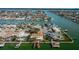 Aerial view of waterfront property and neighborhood at 11650 4Th E St, Treasure Island, FL 33706