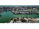 Aerial view of waterfront home with private dock and boat slips at 11650 4Th E St, Treasure Island, FL 33706