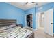 Spacious bedroom with light blue walls, a comfortable bed, and a large closet at 12152 Ledbury Commons Dr, Gibsonton, FL 33534