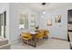 Charming dining area with a wooden table and mustard yellow chairs at 12152 Ledbury Commons Dr, Gibsonton, FL 33534