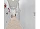 Bright hallway with tile flooring and unique wall art at 12152 Ledbury Commons Dr, Gibsonton, FL 33534