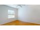 Well-lit bedroom featuring hardwood floors and window at 1237 N Mcmullen Booth Rd # 1237, Clearwater, FL 33759