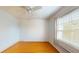 Bright bedroom with hardwood floors and window at 1237 N Mcmullen Booth Rd # 1237, Clearwater, FL 33759