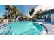 Community pool with lounge chairs and surrounding landscaping at 1237 N Mcmullen Booth Rd # 1237, Clearwater, FL 33759