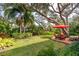 Large backyard with lush landscaping at 1320 Fairway Dr, Dunedin, FL 34698