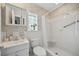 Clean bathroom with shower, toilet and vanity at 1320 Fairway Dr, Dunedin, FL 34698