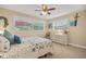 Charming bedroom with a queen bed and dresser at 1320 Fairway Dr, Dunedin, FL 34698