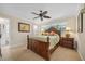 Spacious bedroom with wood furniture and ensuite bathroom at 1320 Fairway Dr, Dunedin, FL 34698