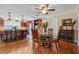 Dining area with hardwood floors and adjacent to the kitchen at 1320 Fairway Dr, Dunedin, FL 34698