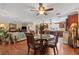 Bright dining area with hardwood floors and view into kitchen at 1320 Fairway Dr, Dunedin, FL 34698