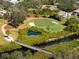 Aerial of golf course with water features at 1320 Fairway Dr, Dunedin, FL 34698