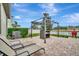 Outdoor patio with pergola, seating and a grill at 13355 Orca Sound Dr, Riverview, FL 33579