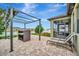 Relaxing backyard patio with pergola and lounge chairs at 13355 Orca Sound Dr, Riverview, FL 33579