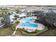 Aerial view of community pool with lap lanes, water features, and lounge area at 13355 Orca Sound Dr, Riverview, FL 33579