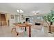 Open concept dining area with a wooden table and modern chairs at 13355 Orca Sound Dr, Riverview, FL 33579