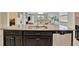 Granite kitchen island with double sink and dishwasher at 13355 Orca Sound Dr, Riverview, FL 33579