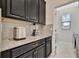 Laundry room with washer, dryer, and built-in shelving at 13355 Orca Sound Dr, Riverview, FL 33579