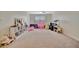 Fun playroom featuring a playhouse, seating, and toys at 13355 Orca Sound Dr, Riverview, FL 33579