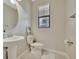 Clean powder room with pedestal sink and toilet at 13355 Orca Sound Dr, Riverview, FL 33579