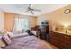 Second bedroom with twin bed and crib, plus dresser and closet at 1344 Pine Ridge E Cir # D2, Tarpon Springs, FL 34688