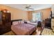 Spacious bedroom with a queen bed and twin bed, plus ample closet space at 1344 Pine Ridge E Cir # D2, Tarpon Springs, FL 34688