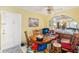 Dining area with wood table and chairs, near entryway at 1344 Pine Ridge E Cir # D2, Tarpon Springs, FL 34688