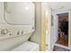 Stackable washer and dryer in a small laundry room at 1344 Pine Ridge E Cir # D2, Tarpon Springs, FL 34688