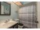 Bathroom with a shower/tub combo and dark wood vanity at 14315 Arbor Hills Rd, Tampa, FL 33625