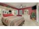 Spacious bedroom with a large bed, mirrored wardrobe, and a ceiling fan at 14315 Arbor Hills Rd, Tampa, FL 33625