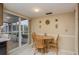 Cozy breakfast nook with wood table and chairs, overlooking a patio at 14315 Arbor Hills Rd, Tampa, FL 33625