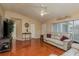 Living room with hardwood floors, neutral walls and comfy sofas at 14315 Arbor Hills Rd, Tampa, FL 33625