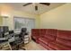 Home office featuring a work desk and a comfortable couch at 14315 Arbor Hills Rd, Tampa, FL 33625