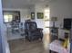 Open living space with dining area, and view into the kitchen at 1515 Forrest Nelson Blvd # E108, Port Charlotte, FL 33952