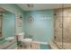 Bathroom with shower, toilet and mirror at 1520 Gulf Blvd # 1404, Clearwater Beach, FL 33767