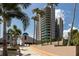 Condo building exterior showcasing palm trees and architecture at 1520 Gulf Blvd # 1404, Clearwater Beach, FL 33767