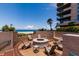 Relaxing fire pit area with seating, overlooking the ocean at 1520 Gulf Blvd # 1404, Clearwater Beach, FL 33767