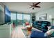 Living room boasts hardwood floors, large windows, and ocean views at 1520 Gulf Blvd # 1404, Clearwater Beach, FL 33767