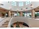 Elegant condo lobby with a circular staircase and high ceilings at 1520 Gulf Blvd # 1404, Clearwater Beach, FL 33767