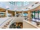 Elegant building lobby with a grand staircase and tranquil water feature at 1520 Gulf Blvd # 1404, Clearwater Beach, FL 33767