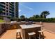 Outdoor kitchen with built-in grills and a granite countertop at 1520 Gulf Blvd # 1404, Clearwater Beach, FL 33767