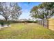 Large backyard with grassy area, swing set, and fire pit at 1610 Allenton Ave, Brandon, FL 33511