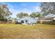 Large backyard with grassy area and patio at 1610 Allenton Ave, Brandon, FL 33511