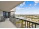 Balcony with rocking chairs and waterfront view at 1660 Gulf Blvd # Ph1, Clearwater Beach, FL 33767