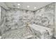 Spa-like bathroom with marble tile and soaking tub at 1660 Gulf Blvd # Ph1, Clearwater Beach, FL 33767