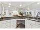 Large bathroom with corner vanity and granite top at 1660 Gulf Blvd # Ph1, Clearwater Beach, FL 33767