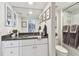 Bathroom with granite countertop and white cabinets at 1660 Gulf Blvd # Ph1, Clearwater Beach, FL 33767