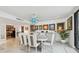 Elegant dining room with large table and chandelier at 1660 Gulf Blvd # Ph1, Clearwater Beach, FL 33767