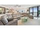 Spacious living room with a large sectional sofa and ocean views at 1660 Gulf Blvd # Ph1, Clearwater Beach, FL 33767