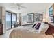 Comfortable main bedroom with ocean views and artwork at 1660 Gulf Blvd # Ph1, Clearwater Beach, FL 33767