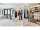 Spacious walk-in closet with built-in shelving and drawers at 1660 Gulf Blvd # Ph1, Clearwater Beach, FL 33767